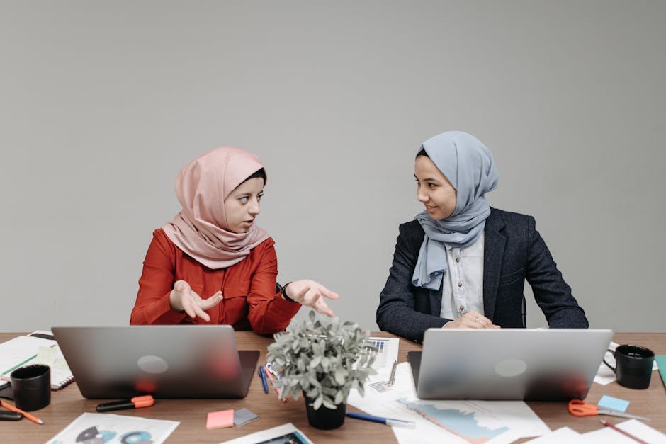 Analyst reviewing stock market charts on multiple screens