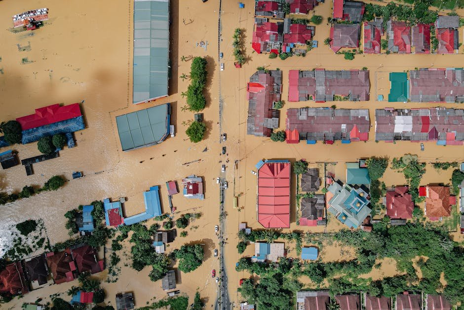 Rescue team evacuating residents through flooded Mumbai streets